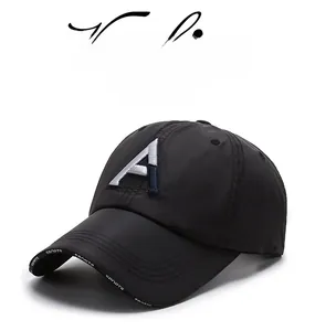 Detail of black quick-dry baseball cap with white A embroidery and sports brim text