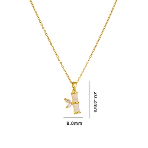 Elegant gold bamboo necklace with green cat-eye stone and sparkling cubic zirconia stones