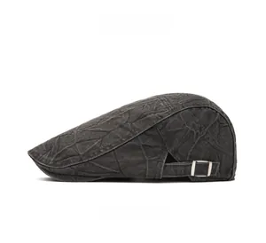 Detailed side view of charcoal grey newsboy cap with vintage texture and metal buckle