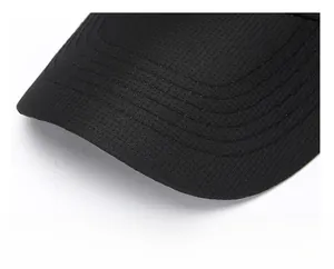Macro shot of durable mesh fabric and reinforced visor with five-row stitching on baseball cap
