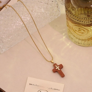 Elegant gold ball chain necklace with brown aventurine cross pendant and crystal accents