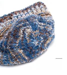 Macro detail of reinforced stitching on top of the colorful knit bucket hat