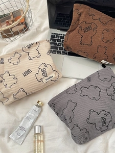 Corduroy makeup bags with cute bear prints in beige, brown, and grey earth tones