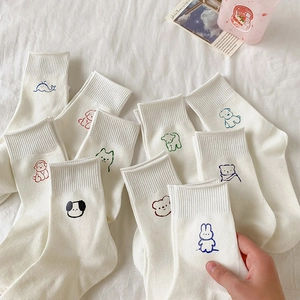 White cotton mid-calf socks with colorful cartoon animal embroidery and ribbed cuffs