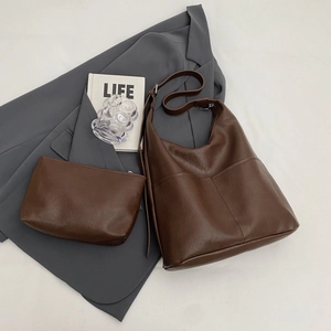 Brown vintage faux leather tote bag with matching makeup pouch and adjustable strap