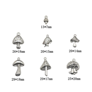 Set of 7 vintage silver alloy mushroom charms in various sizes for DIY jewelry making