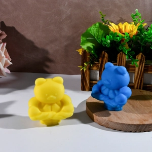 Detailed view of yellow and blue muscular bear silicone molds for creative DIY candles