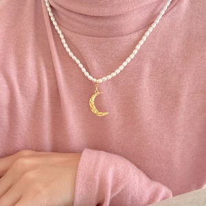 925 Sterling Silver necklace featuring small white pearls and a hammered gold crescent moon