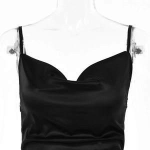 Detail of elegant black satin cowl neck dress with thin spaghetti straps for formal evening wear