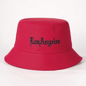 Detail shot of Los Angeles gothic embroidery on red cotton twill bucket hat texture