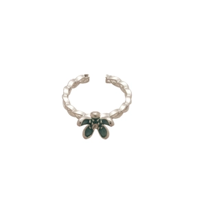 Silver adjustable flower ring with dark green petals and crystal center on white background