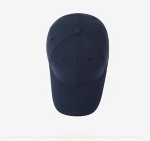Top view of navy blue baseball cap showing six-panel structure and stitched brim details
