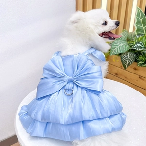 Detail of light blue satin pet wedding dress with large bow and metal D-ring for leash