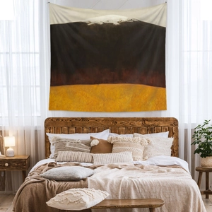 Detail view of Bohemian abstract landscape tapestry hanging on a cozy bedroom wall