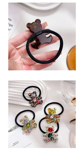 Detail of bear hair ties with tortoise shell finish and colorful rhinestones