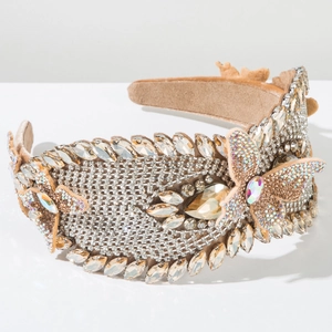 Detail of wide headband featuring 3D butterflies and sparkling champagne rhinestones
