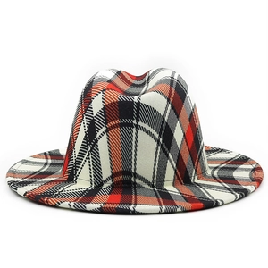 Detail of red and black tartan fedora hat featuring a classic british style felt design