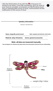 Detailed view of pink dragonfly brooch with alloy rhinestones measuring 9.2cm x 6.6cm