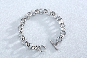 Detailed shot of silver stainless steel rolo chain bracelet with a classic toggle clasp