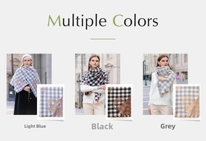 Detail view of plaid scarves in light blue, black, and grey with floral motifs and fringes