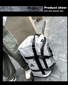 Close-up of waterproof Oxford fabric travel bag with TUSEN logo and sturdy handles