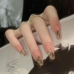 Champagne gold glitter french tip coffin press-on nails in nude pink base color