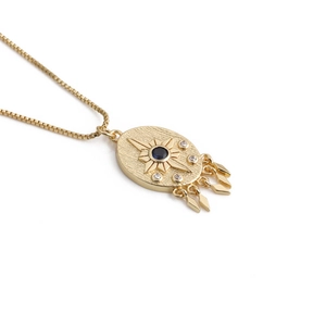Golden Evil Eye pendant necklace with sunburst pattern, blue stone and small tassels