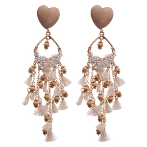 Bohemian heart-shaped wood earrings with cream beads and long tassel fringes