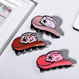 Three creative denim hat hair claws in pink and red with leopard star patterns
