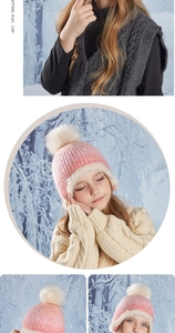 Detail of pink knitted kids winter hat featuring soft fleece lining and fluffy pompom