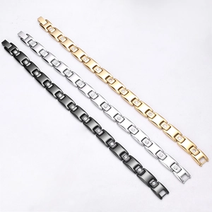 Pyramid magnetic bracelets in black, silver, and gold steel with sparkling crystal inlays