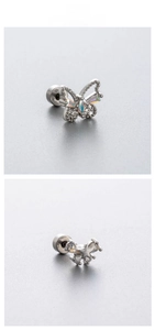Detail of titanium steel butterfly and star ear studs with blue iridescent zircon stones