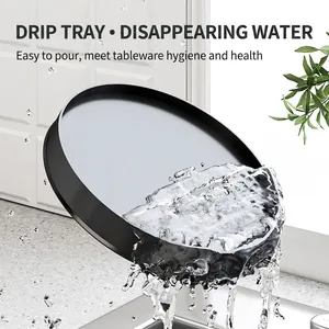 Rotating kitchen knife holder with a black round drain tray for quick water disposal