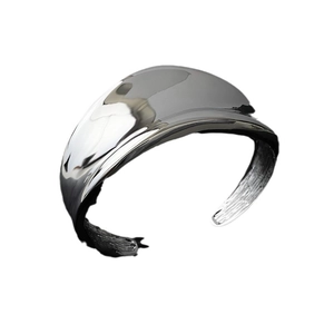 Irregular wide open cuff bracelet in minimalist silver high-polish sculptural style