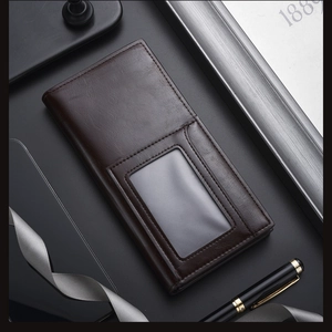 Detail of dark brown long business leather wallet with clear ID window and card slots