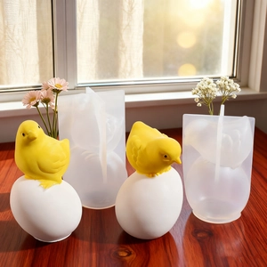 Silicone mold kit for DIY Easter chick candles and plaster ornaments on a wooden table