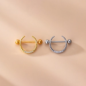 Star and moon nipple rings in gold and silver finish with micro-inlaid cubic zirconia