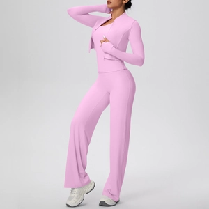 Pink 3-piece yoga set with zip jacket, vest and wide leg pants in a studio shot