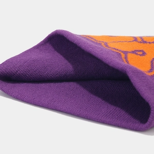 Winter jacquard knit beanie featuring purple and orange heart pattern and ribbed texture