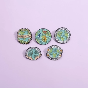 Set of 5 cartoon eco-friendly enamel pins with Earth Day theme on purple background