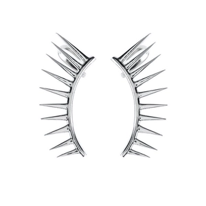 Detailed close-up of silver-toned metal wing earrings with a sharp spiked radial design