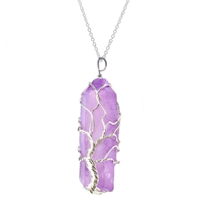 Detailed view of handmade tree of life wire-wrapped amethyst hexagonal crystal pendant