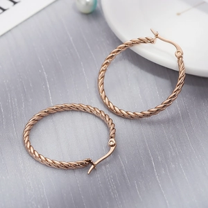 Rose gold twisted rope hoop earrings in premium titanium steel with 18k gold plating