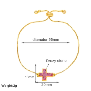 Detailed view of adjustable gold cross bracelet featuring a 13x20mm pink druzy stone