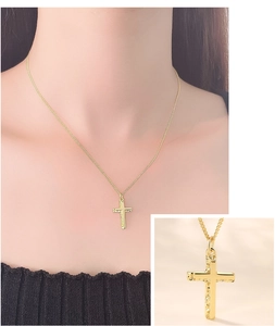 Detail view of a gold irregular textured cross pendant and a minimalist model lifestyle shot