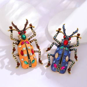 Spille a scarabeo vintage arancione e blu con strass e placcatura in oro antico