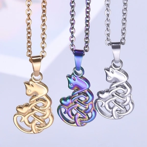Cat heart necklace in gold, silver, and iridescent finishes with Celtic knot details