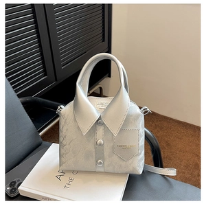Detail of creative shirt-shaped crossbody bag in light grey with marble texture