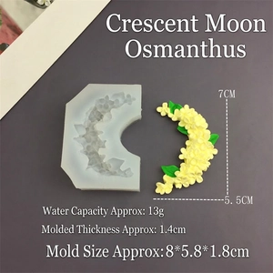 Macro detail of moon-shaped osmanthus flower silicone mold with yellow resin cast