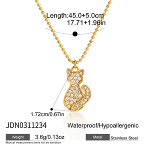Detail of 18K gold stainless steel cat pendant necklace with white zircon pavé details